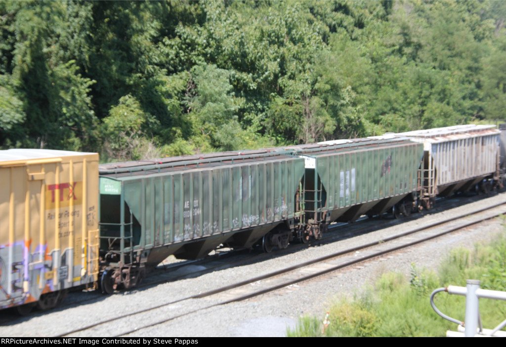 Ex CNW hoppers AEQX 810154 and 810204 departing Enola yard on train 15T
